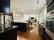 Open-concept kitchen boasts a large island, modern appliances, and seamless flow to the living area at 1159 Fort Marcy Park, Lawrenceville, GA 30044