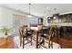 Kitchen with dark wood cabinets open to dining area at 1159 Fort Marcy Park, Lawrenceville, GA 30044