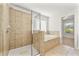 Beautiful main bathroom featuring both a tiled shower and a large soaking tub at 1159 Fort Marcy Park, Lawrenceville, GA 30044