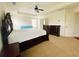 Expansive main bedroom with carpet, ceiling fan, and natural light from windows at 1159 Fort Marcy Park, Lawrenceville, GA 30044