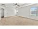 Large main bedroom featuring a ceiling fan, a tray ceiling and bright windows at 1159 Fort Marcy Park, Lawrenceville, GA 30044