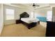Spacious main bedroom with tray ceiling, plush carpet and bright windows at 1159 Fort Marcy Park, Lawrenceville, GA 30044