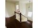 This wooden staircase features white balusters and dark wood steps at 1159 Fort Marcy Park, Lawrenceville, GA 30044