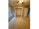 Bedroom with a window with blinds, a ceiling fan, carpet, and an open closet at 2020 Wynfield Point Dr, Buford, GA 30519