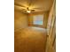 Comfortable carpeted bedroom with natural light from the window and a ceiling fan at 2020 Wynfield Point Dr, Buford, GA 30519