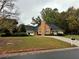 Charming brick home featuring a well-manicured lawn and an inviting driveway at 2020 Wynfield Point Dr, Buford, GA 30519