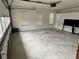 Spacious garage with windows, a garage door, and storage cabinets at 2020 Wynfield Point Dr, Buford, GA 30519