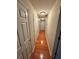 Hallway featuring hardwood floors and multiple doors leading to other rooms at 2020 Wynfield Point Dr, Buford, GA 30519