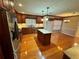 Gourmet kitchen featuring custom wood cabinetry, a central island, and stainless steel appliances at 2020 Wynfield Point Dr, Buford, GA 30519