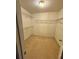 Spacious walk-in closet with carpeted floors and multiple levels of wire shelving for ample storage space at 2020 Wynfield Point Dr, Buford, GA 30519