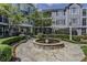 Beautiful courtyard featuring a fountain, lush greenery, and charming stone pathways at 4100 Paces Se Walk # 3205, Atlanta, GA 30339