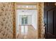 Welcoming foyer with hardwood floors, chandelier, and floral wallpaper at 4100 Paces Se Walk # 3205, Atlanta, GA 30339