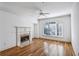 Living room featuring fireplace, hardwood flooring, and a large window at 4100 Paces Se Walk # 3205, Atlanta, GA 30339
