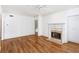Open living room with hardwood floors and a fireplace at 4100 Paces Se Walk # 3205, Atlanta, GA 30339