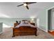 Bedroom with fan, carpet flooring and wooden bed at 22107 Harvest Ridge Ln # 22, Alpharetta, GA 30022