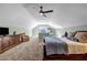 Spacious bedroom with carpet flooring, fan and walk in closet at 22107 Harvest Ridge Ln # 22, Alpharetta, GA 30022