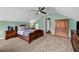 Spacious bedroom features soft carpeting and ceiling fan at 22107 Harvest Ridge Ln # 22, Alpharetta, GA 30022