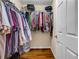 Walk-in closet with rods and shelves providing ample storage space at 22107 Harvest Ridge Ln # 22, Alpharetta, GA 30022