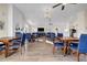 Spacious dining area with ample seating and elegant lighting fixtures at 22107 Harvest Ridge Ln # 22, Alpharetta, GA 30022