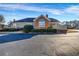 Exterior side view of home with partial brick wall at 22107 Harvest Ridge Ln # 22, Alpharetta, GA 30022