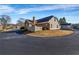 Charming single-story home boasts a brick chimney and well-maintained landscaping at 22107 Harvest Ridge Ln # 22, Alpharetta, GA 30022