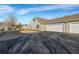 Exterior view of a property with garages and driveway at 22107 Harvest Ridge Ln # 22, Alpharetta, GA 30022