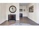 Inviting hallway with elegant mirror and dark wood flooring at 22107 Harvest Ridge Ln # 22, Alpharetta, GA 30022