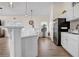 Stylish kitchen features white cabinets, a large island, and stainless steel appliances at 22107 Harvest Ridge Ln # 22, Alpharetta, GA 30022