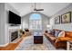 Bright living room with hardwood floors, large windows, and cozy fireplace at 22107 Harvest Ridge Ln # 22, Alpharetta, GA 30022
