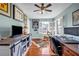 Bright and airy home office features hardwood floors, plantation shutters, and ample desk space at 22107 Harvest Ridge Ln # 22, Alpharetta, GA 30022
