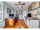 Spacious home office features hardwood floors, built in storage, and plenty of natural light at 22107 Harvest Ridge Ln # 22, Alpharetta, GA 30022