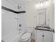 Cozy bathroom featuring a shower-tub combo, subway tile surround, and a single sink vanity at 374 Lamancha Ct, Lawrenceville, GA 30044