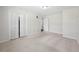 Spacious bedroom features neutral carpet, bi-fold closet, and a doorway leading to other rooms at 374 Lamancha Ct, Lawrenceville, GA 30044