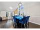 Bright dining room, hardwood floors and modern lighting fixture at 374 Lamancha Ct, Lawrenceville, GA 30044