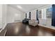 Spacious living area with hardwood floors and plenty of natural light from large windows at 374 Lamancha Ct, Lawrenceville, GA 30044