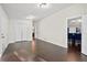 Spacious living area with hardwood floors and doorways to dining and bedrooms at 374 Lamancha Ct, Lawrenceville, GA 30044
