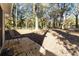 Inviting backyard deck nestled among mature trees offers a relaxing outdoor living space at 1652 Pine Cir, Austell, GA 30168