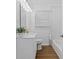 Clean bathroom with a modern vanity, stylish mirror, and tiled shower/bath combination at 1652 Pine Cir, Austell, GA 30168