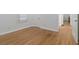 Bright bedroom with hardwood floors, white walls, and views to an en-suite at 1652 Pine Cir, Austell, GA 30168