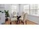 Bright dining room with a glass-top table, upholstered chairs, and bright windows for natural light at 1652 Pine Cir, Austell, GA 30168