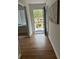 Inviting entryway featuring hardwood floors, a modern front door, and stylish decor at 1652 Pine Cir, Austell, GA 30168