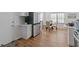 Modern kitchen with white cabinets, stainless steel appliances, and hardwood floors at 1652 Pine Cir, Austell, GA 30168