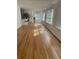 Open-concept living space with hardwood floors, a breakfast bar, and plenty of natural light at 1652 Pine Cir, Austell, GA 30168
