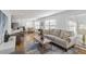 Inviting living room featuring a comfortable sofa, modern decor, and lots of sunlight at 1652 Pine Cir, Austell, GA 30168