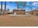 Backyard featuring a brick house with a garage, long driveway, and vast lawn at 2344 Hollyridge Sw Dr, Marietta, GA 30060