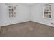 A cozy bedroom featuring neutral carpet and walls with natural light at 2344 Hollyridge Sw Dr, Marietta, GA 30060