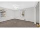 Bright bedroom with neutral walls, carpet, and a ceiling fan at 2344 Hollyridge Sw Dr, Marietta, GA 30060