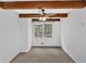 Bright bedroom with a ceiling fan and exposed wood beams overhead at 2344 Hollyridge Sw Dr, Marietta, GA 30060