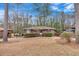 A charming single-story brick home featuring mature trees and a well-maintained lawn at 2344 Hollyridge Sw Dr, Marietta, GA 30060