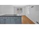 Kitchen island with dark granite counter and wood floors at 2344 Hollyridge Sw Dr, Marietta, GA 30060